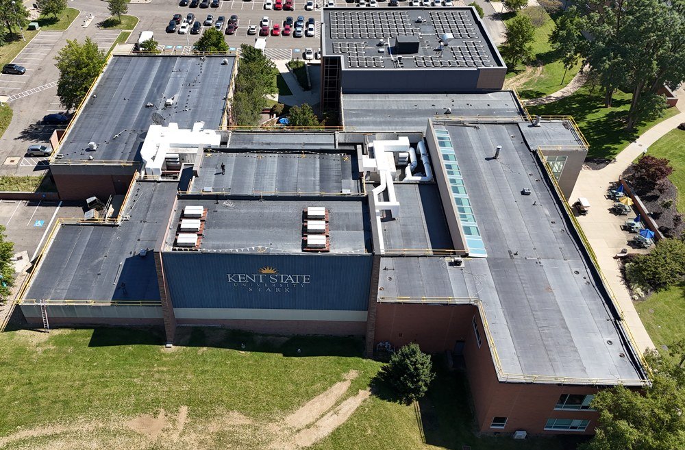 Aerial view of a commercial building with a black Carlisle EPDM membrane roof