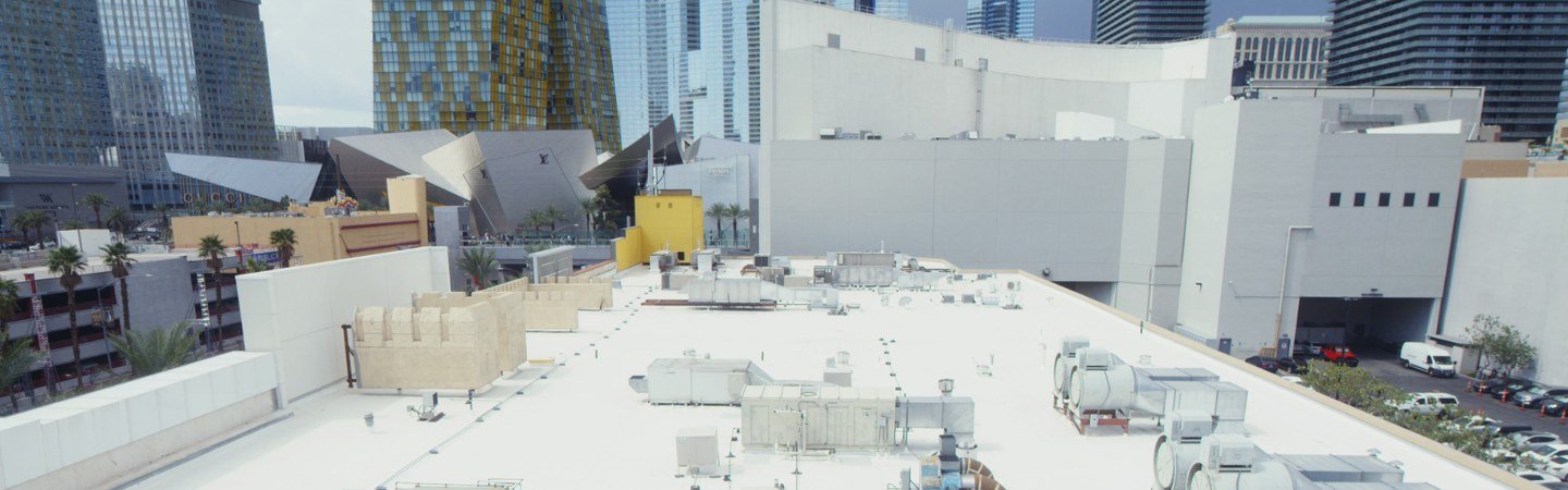 White PVC roof with rooftop equipment on a Johns Manville commercial project