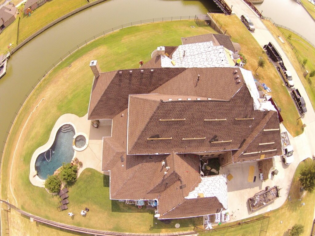 Aerial view of the Golden Hammer award-winning roof replacement in progress, photo 1 of 9