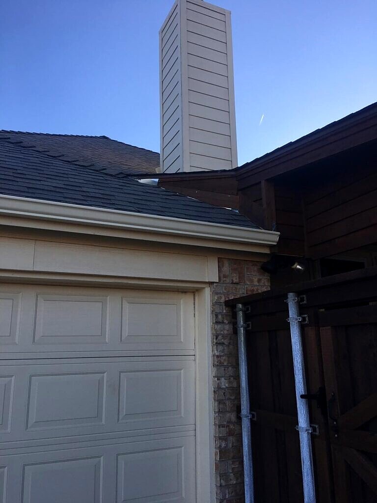 McKinney roof project — completed roof and chimney