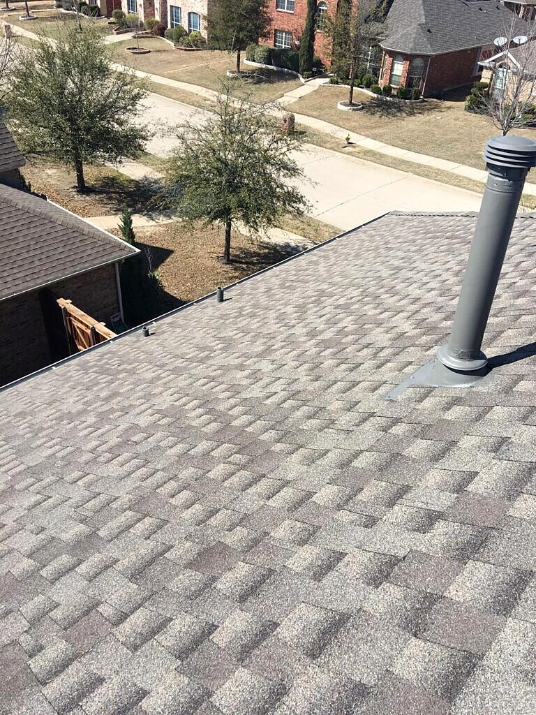 Frisco roofing project — completed roof field