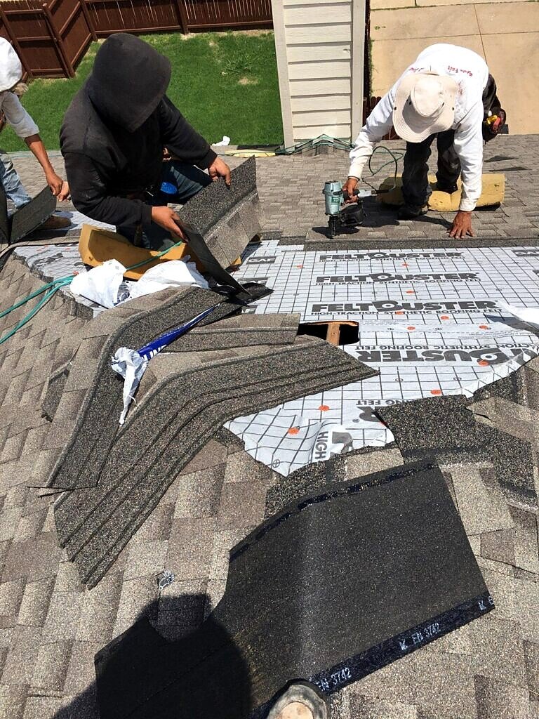 May 2019. Shingle installation at a protected roof detail.