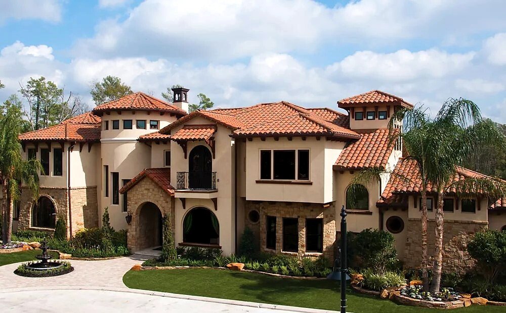 Real US Tile clay roof with curved terracotta-colored tiles on a Mediterranean-style home