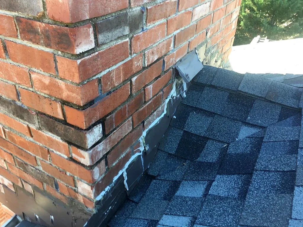 Chimney flashing documented during inspection.