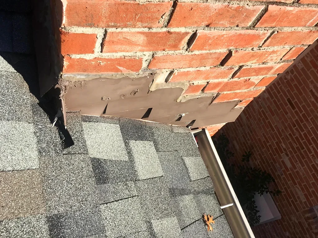 Close view of the chimney-to-roof connection.