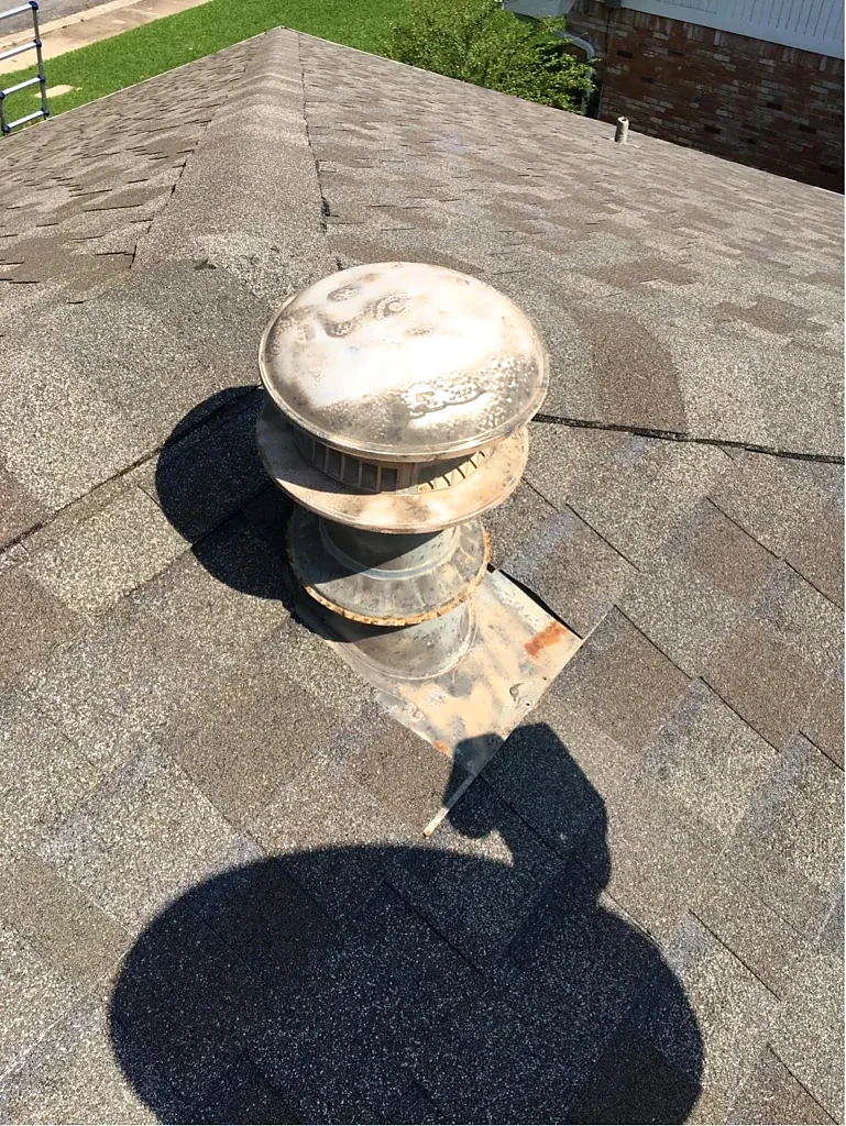 Vent cap and surrounding shingles.