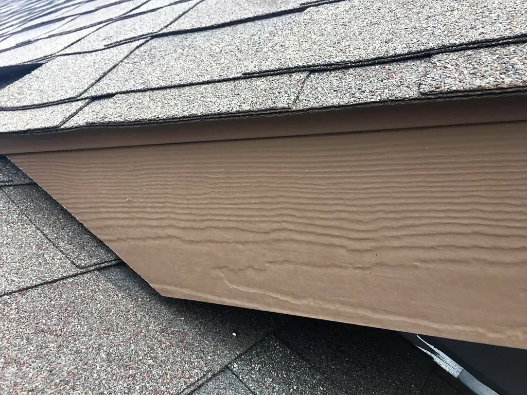 Existing shingles and fascia trim.