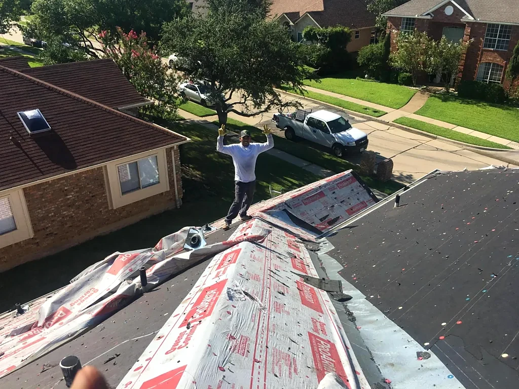 Underlayment and skylight area during roof installation.