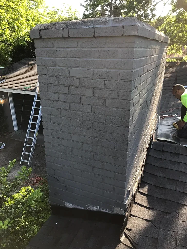 Chimney and adjacent roof connection.