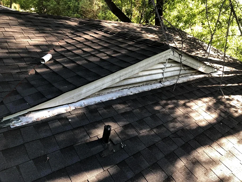 Roof-to-wall trim and shingles.