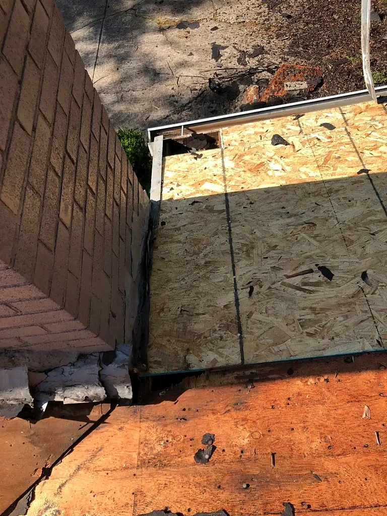Decking repair beside the chimney.