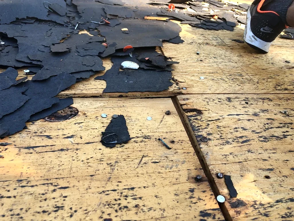 Old roofing removed to expose the decking.
