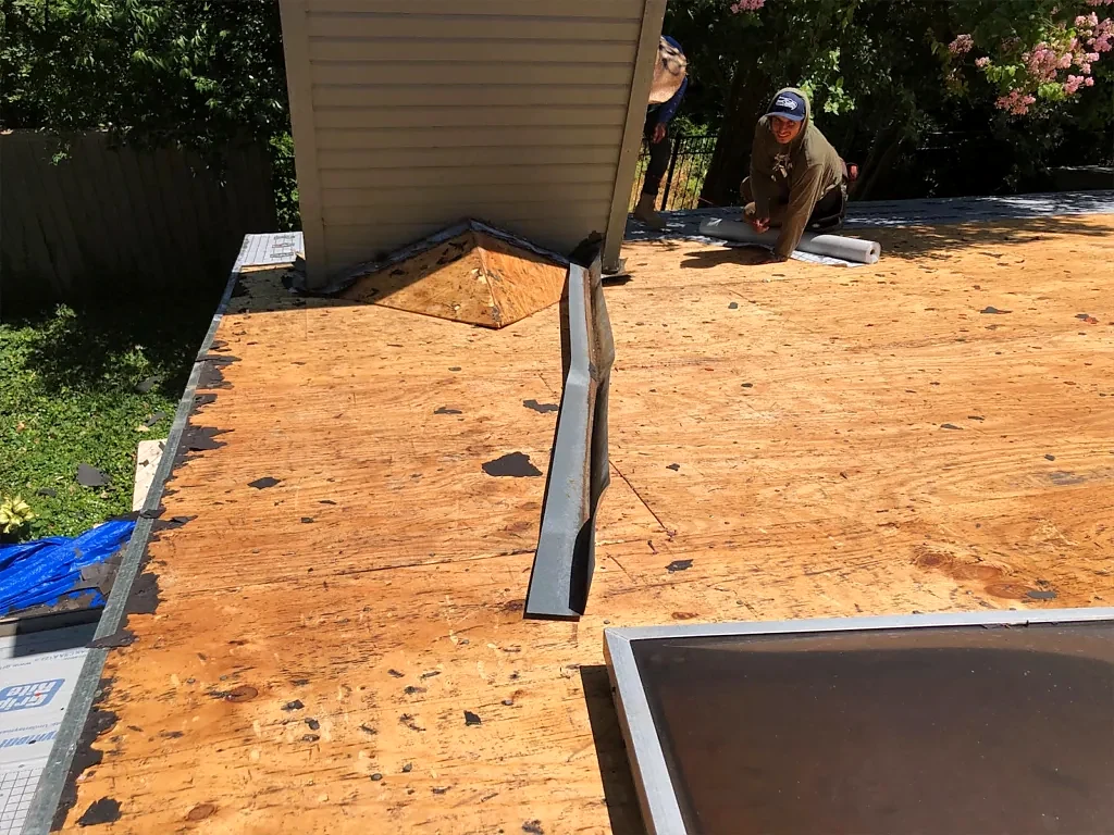 New decking visible around the skylight opening.