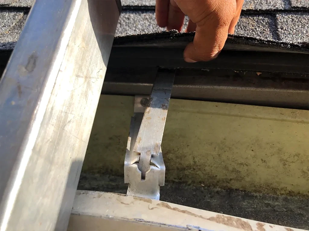 Roof-edge and gutter connection in the follow-up photographs.