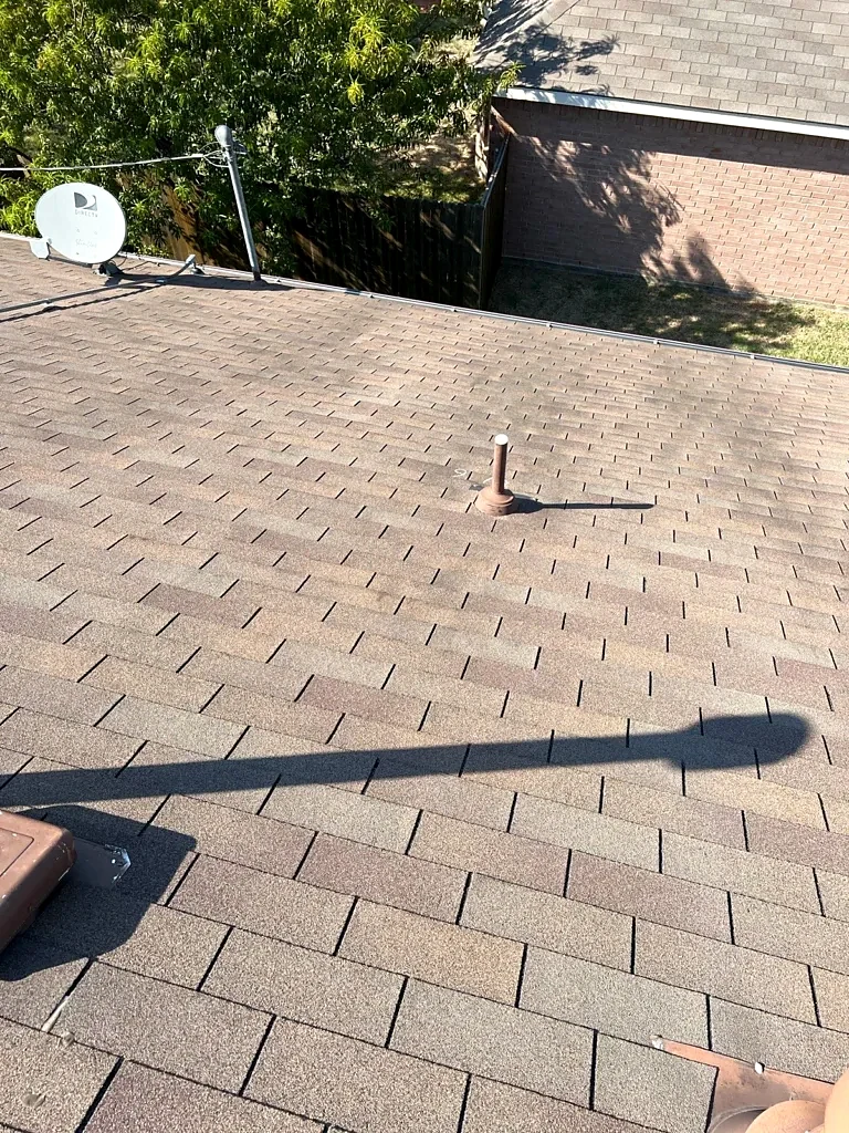 Existing roof slope and pipe penetration.