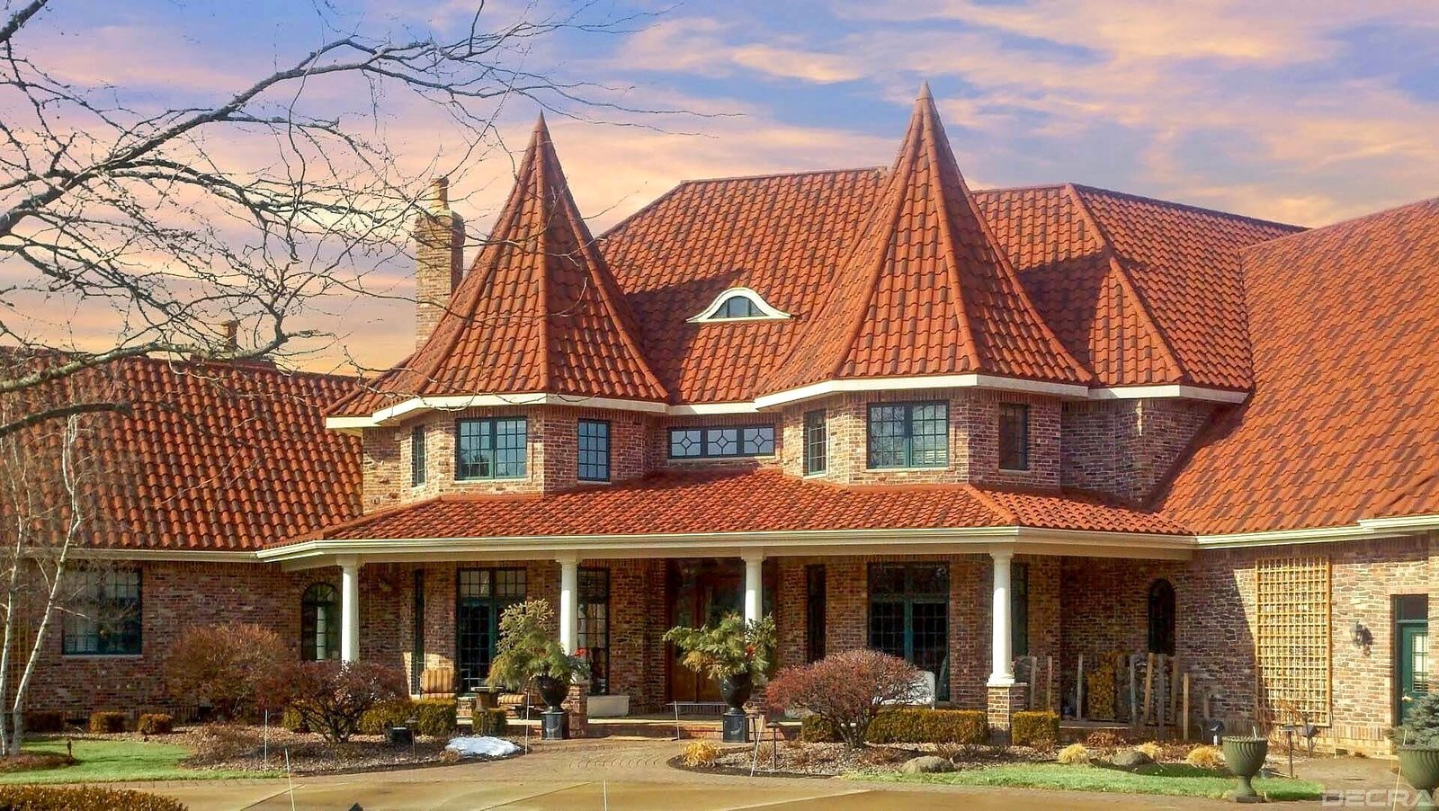 Real DECRA Villa Tile stone-coated steel roofing on a brick home